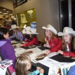 Signing autographs at the CSHA booth at 2013 Cow Palace